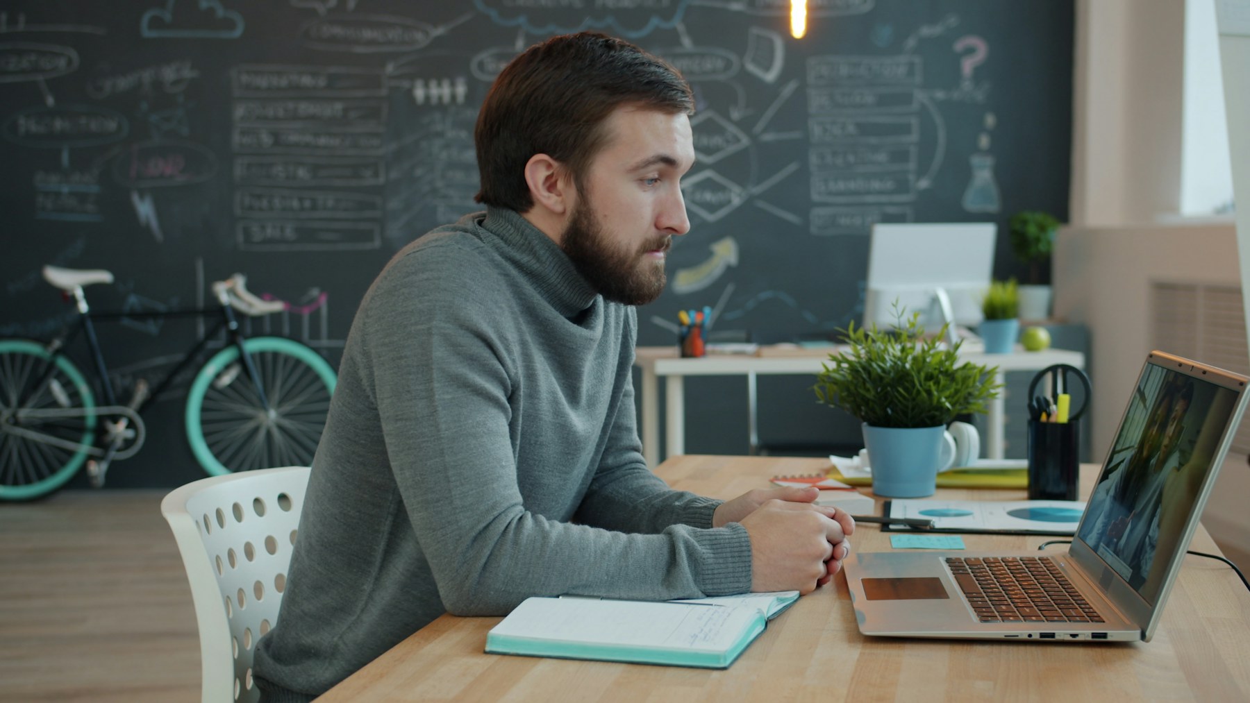 Developer working at a laptop in a modern office